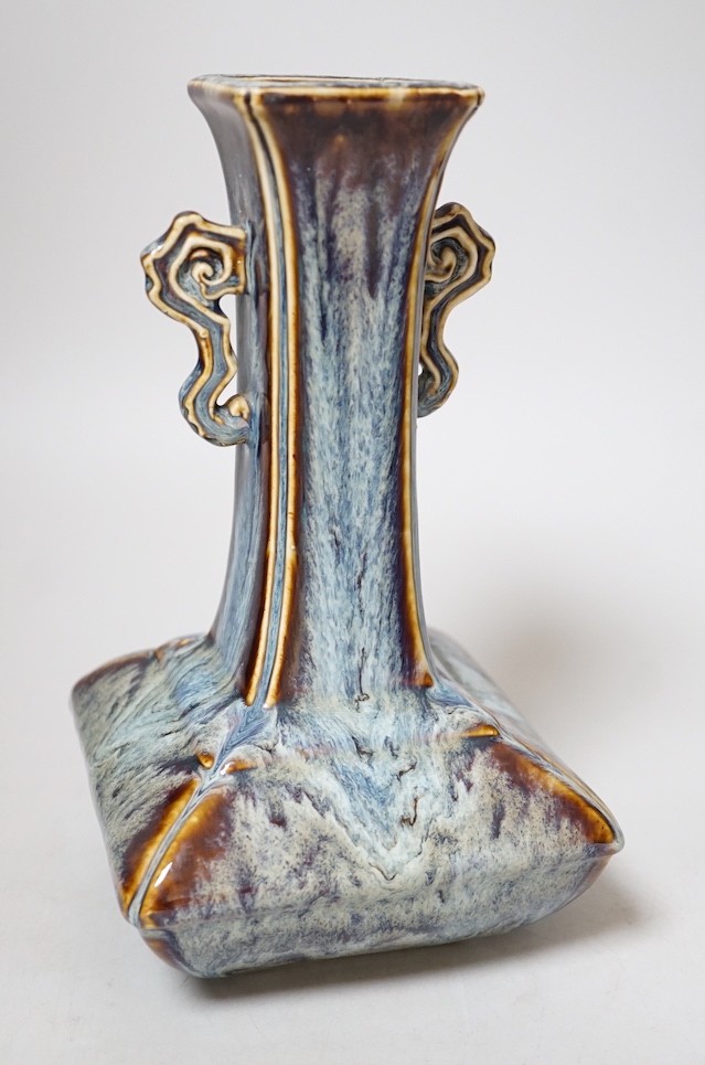 A Chinese Shiwan two handled vase, 23cms high